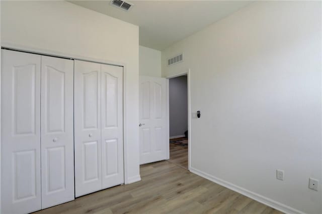 240 Barbossa Dr, Sebastian, FL 32958 - unfurnished bedroom with light wood finished floors and a closet