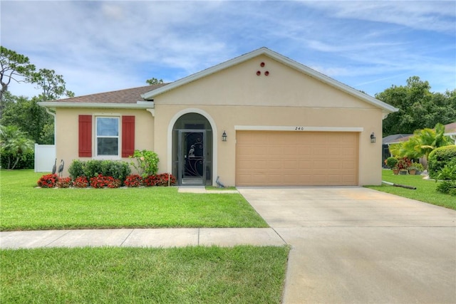 240 Barbossa Dr, Sebastian, FL 32958 - view of front of home with stucco siding, an attached garage, a front yard, and driveway