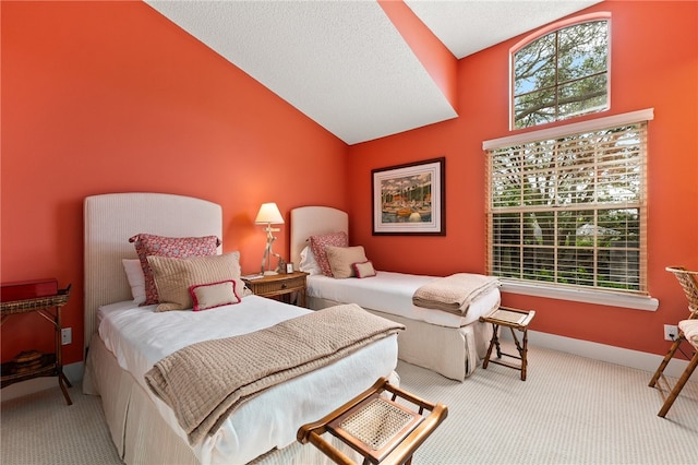 carpeted bedroom featuring multiple windows and high vaulted ceiling