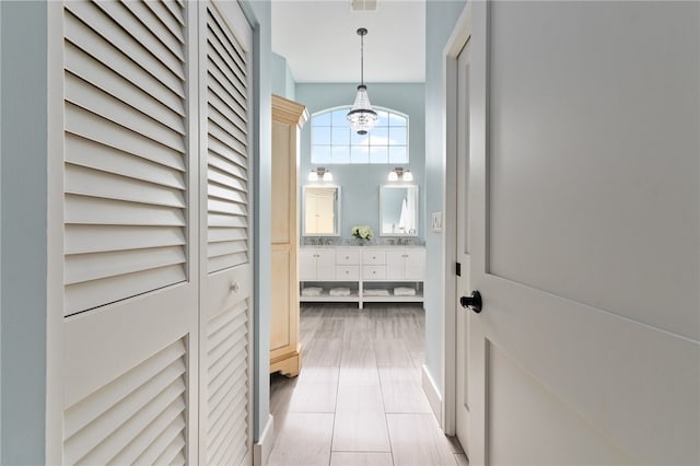 corridor with light tile patterned floors