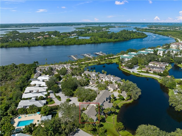 birds eye view of property with a water view