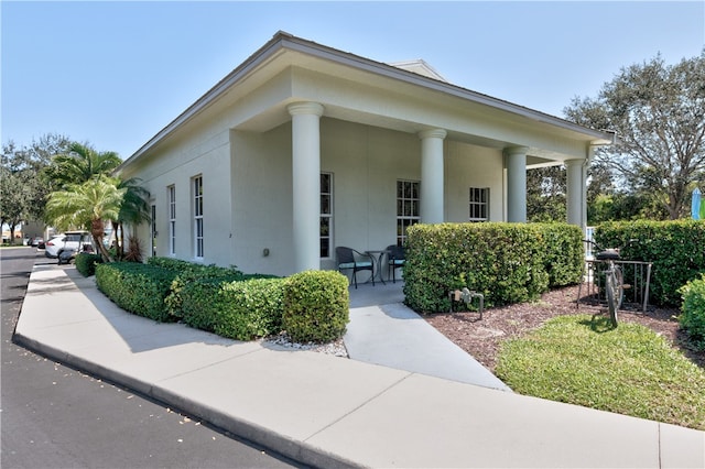 view of property exterior with covered porch