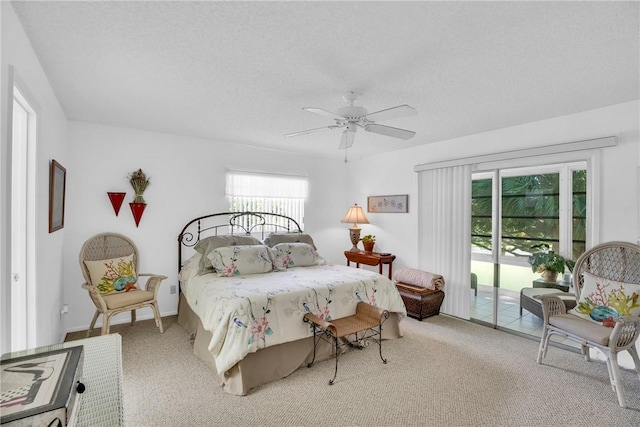 bedroom with carpet flooring, a ceiling fan, access to outside, and a textured ceiling