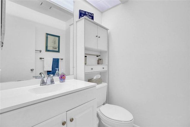half bath with toilet and vanity