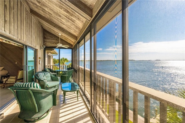 sunroom with vaulted ceiling, wooden ceiling, and a water view