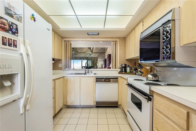 kitchen featuring light tile patterned floors, sink, white appliances, and light brown cabinets