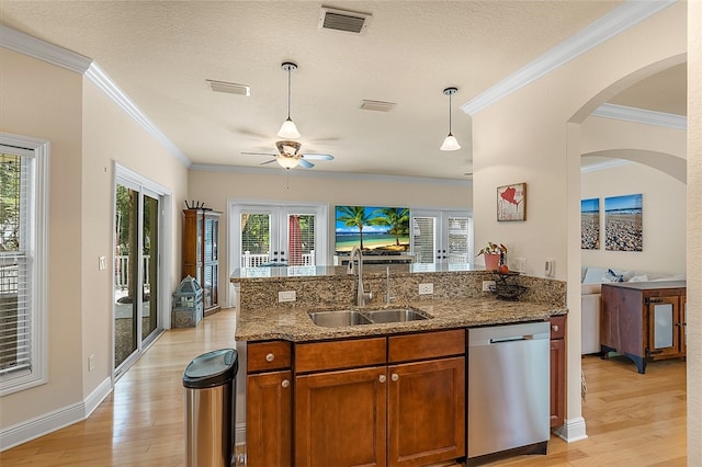 kitchen featuring dishwasher, french doors, sink, light wood-type flooring, and stone counters