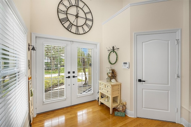 entryway featuring french doors and light hardwood / wood-style flooring