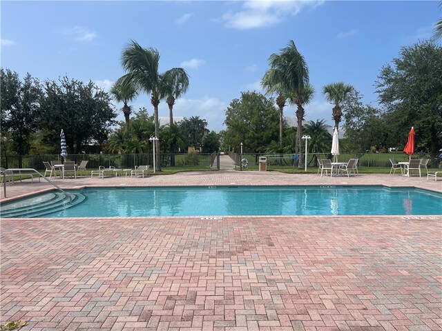 view of swimming pool with a patio