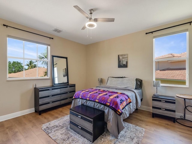 2785 Grand Isle Way SW, Vero Beach, FL 32968 - bedroom featuring baseboards, wood finished floors, and ceiling fan