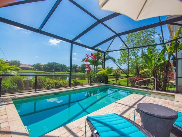 2785 Grand Isle Way SW, Vero Beach, FL 32968 - outdoor pool featuring a water view, a patio area, and a lanai