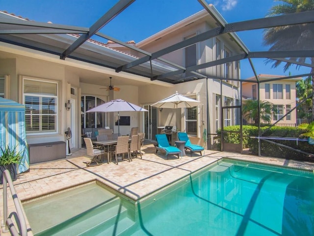 2785 Grand Isle Way SW, Vero Beach, FL 32968 - swimming pool with a patio, a ceiling fan, glass enclosure, and outdoor dining space