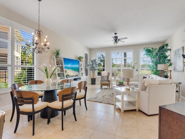 2785 Grand Isle Way SW, Vero Beach, FL 32968 - dining space featuring ceiling fan, a chandelier, light tile patterned floors, and baseboards