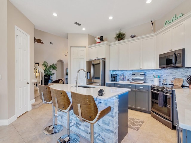2785 Grand Isle Way SW, Vero Beach, FL 32968 - kitchen with appliances with stainless steel finishes, a sink, decorative backsplash, light countertops, and recessed lighting