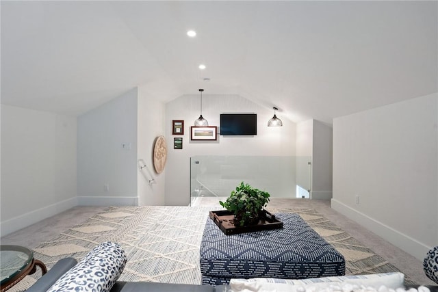 interior space featuring carpet flooring and lofted ceiling