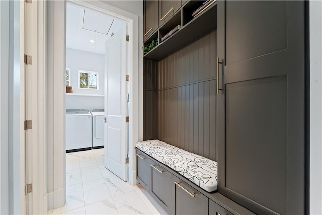 mudroom with washing machine and clothes dryer