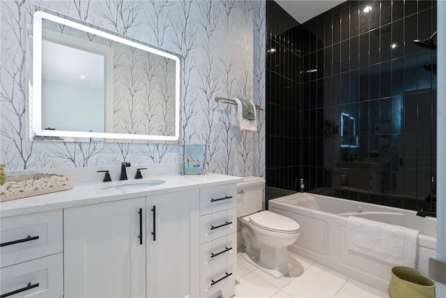 full bathroom featuring tile patterned floors, tiled shower / bath combo, vanity, and toilet