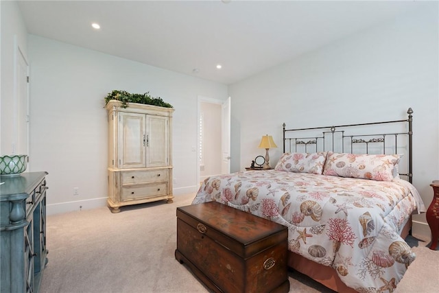 bedroom featuring light carpet