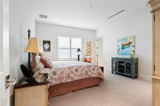 bedroom featuring light carpet