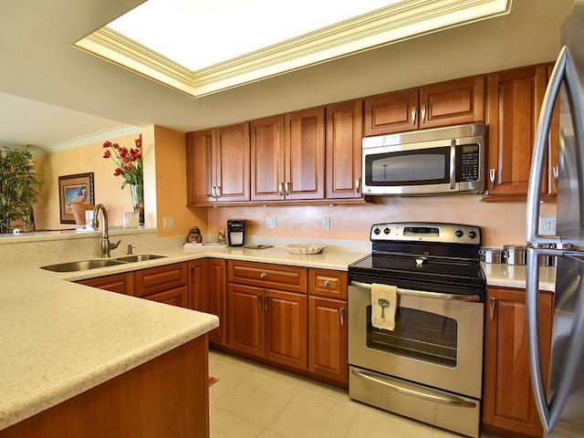 kitchen with stainless steel appliances, sink, crown molding, and light tile patterned floors