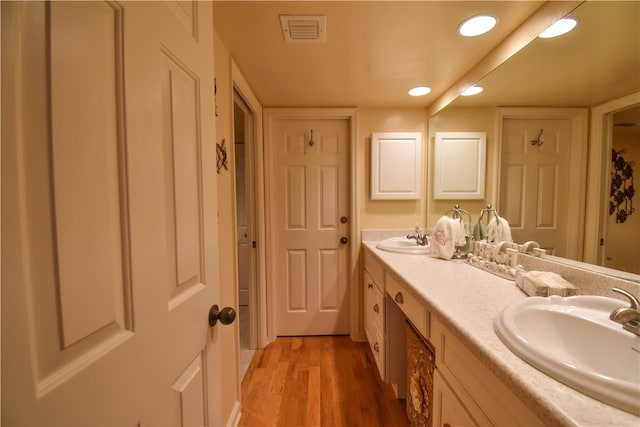 bathroom featuring hardwood / wood-style floors and vanity