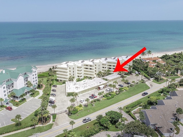 bird's eye view featuring a water view and a view of the beach