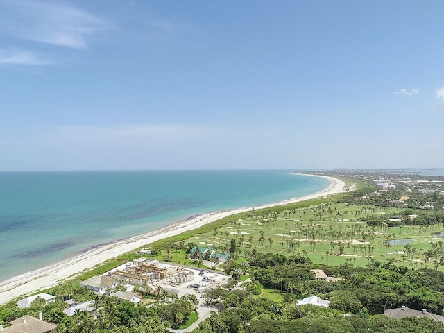 birds eye view of property with a view of the beach and a water view