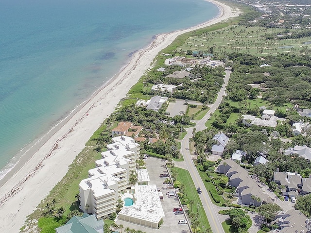 bird's eye view featuring a view of the beach and a water view