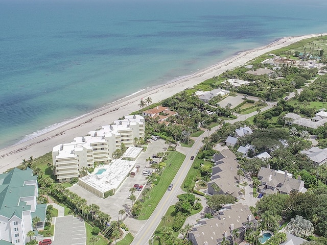 aerial view featuring a view of the beach and a water view