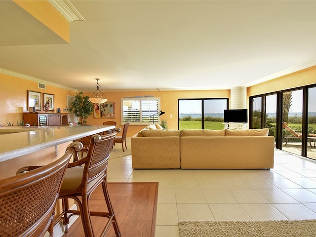 tiled living room featuring crown molding