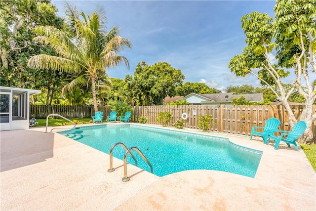 view of swimming pool featuring a patio area, a fenced backyard, and a fenced in pool