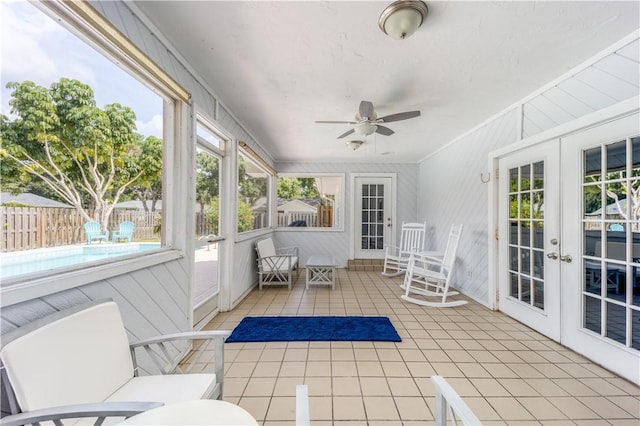 sunroom with french doors and ceiling fan