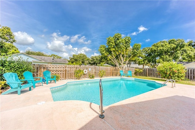 view of swimming pool featuring a patio, a fenced backyard, and a fenced in pool