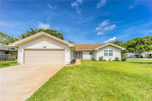 ranch-style home with a garage, a front lawn, and concrete driveway