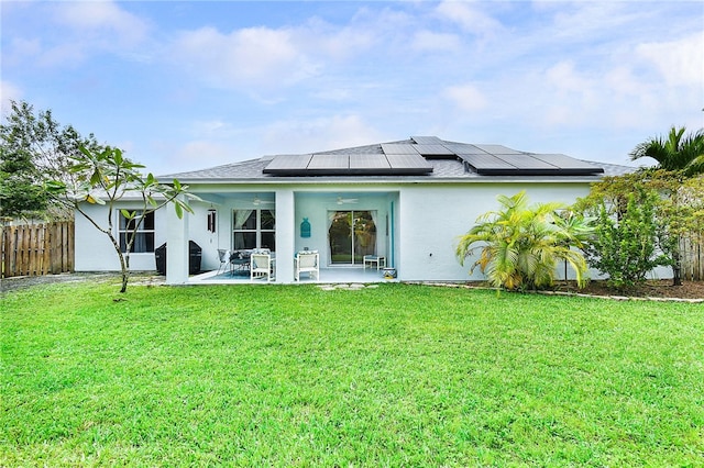 1925 Sylvester Ln, Port St Lucie, FL 34984 - rear view of property featuring a patio, roof mounted solar panels, stucco siding, a shingled roof, and ceiling fan