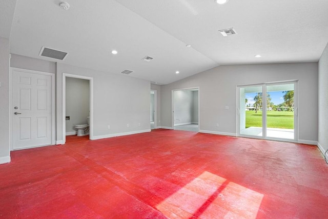 unfurnished room with lofted ceiling and carpet floors