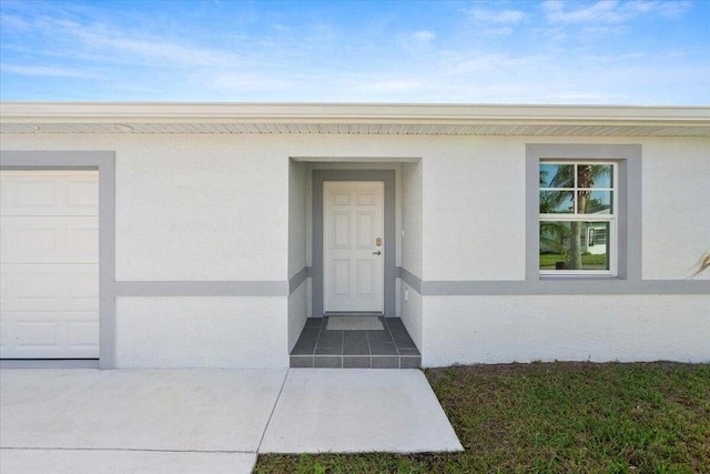 property entrance featuring a garage