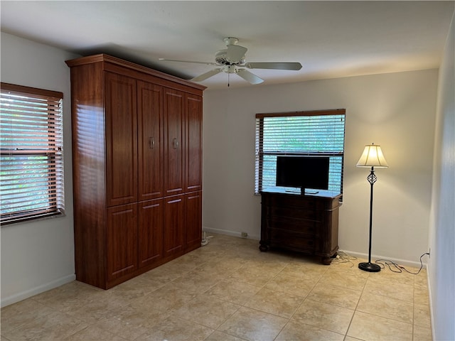 unfurnished bedroom featuring ceiling fan