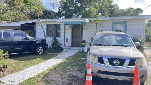 view of front facade with a carport