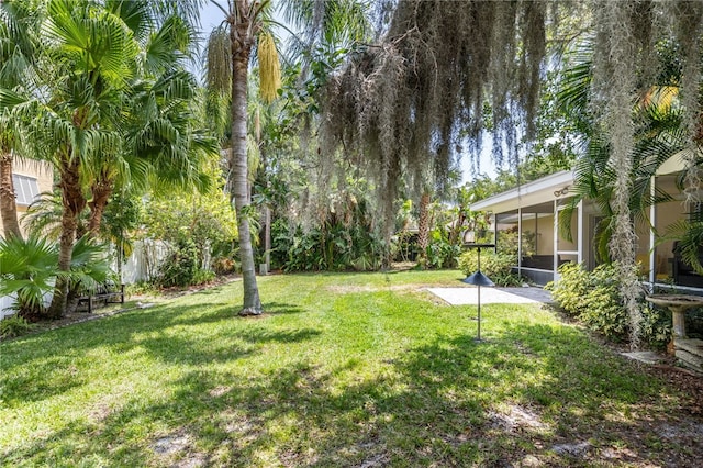 616 Broadway St, Vero Beach, FL 32960 - view of grassy yard featuring a sunroom
