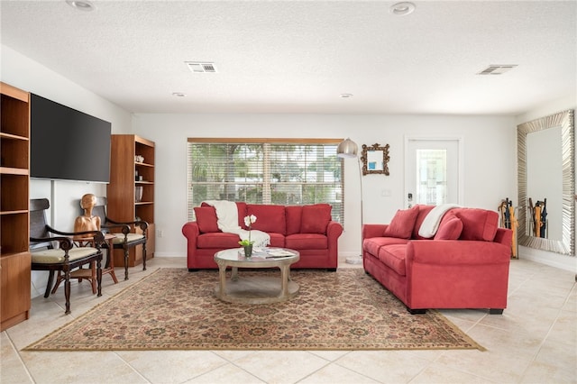 616 Broadway St, Vero Beach, FL 32960 - tiled living area featuring a textured ceiling
