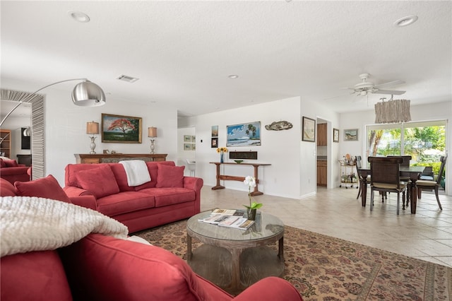 616 Broadway St, Vero Beach, FL 32960 - living room featuring ceiling fan, baseboards, tile patterned floors, a textured ceiling, and recessed lighting