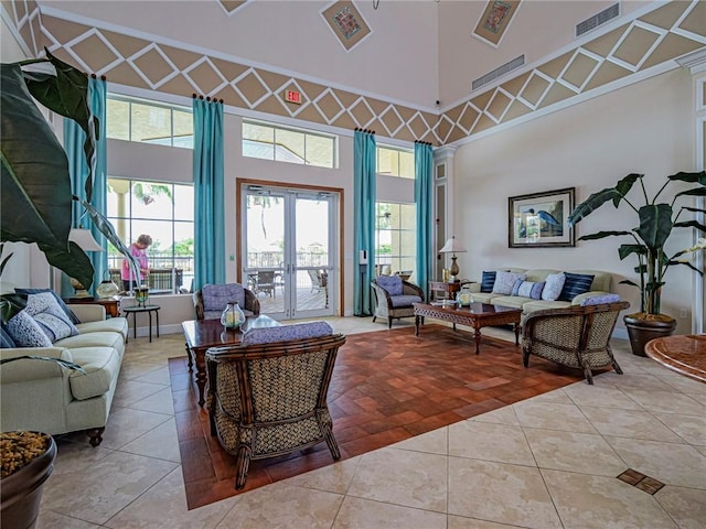6243 Thames Pl, Vero Beach, FL 32966 - living room with tile patterned floors, a high ceiling, and healthy amount of natural light