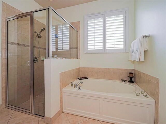 6243 Thames Pl, Vero Beach, FL 32966 - full bath featuring a garden tub, a stall shower, and tile patterned flooring