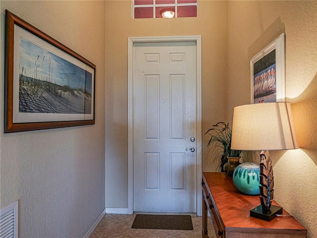 6243 Thames Pl, Vero Beach, FL 32966 - entryway with tile patterned floors and baseboards