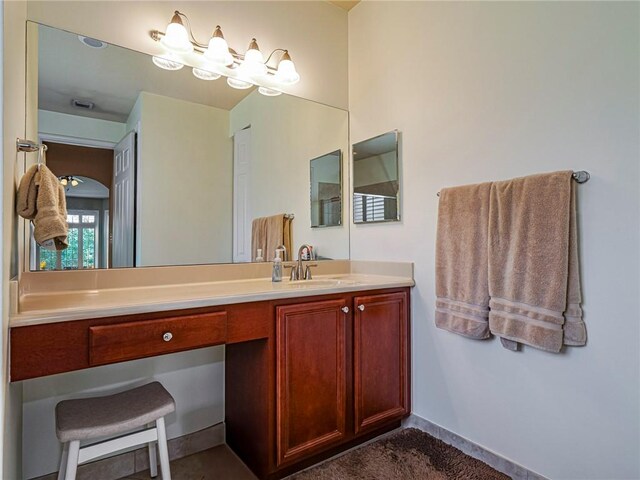 6243 Thames Pl, Vero Beach, FL 32966 - bathroom with vanity and baseboards