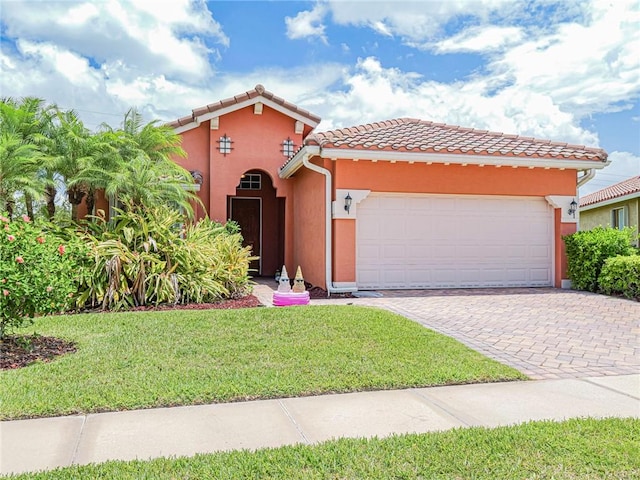 6243 Thames Pl, Vero Beach, FL 32966 - mediterranean / spanish-style house featuring a garage, a tiled roof, stucco siding, a front yard, and driveway