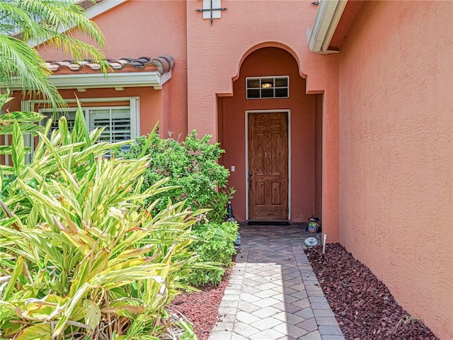 6243 Thames Pl, Vero Beach, FL 32966 - view of exterior entry featuring stucco siding