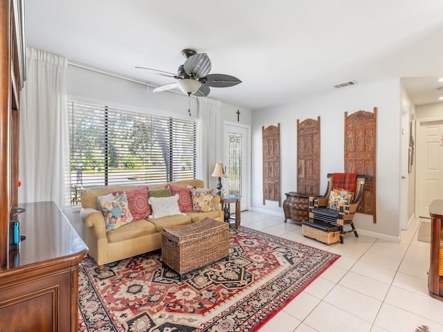 tiled living room featuring ceiling fan