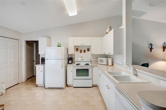 kitchen featuring sink, vaulted ceiling, a textured ceiling, white appliances, and white cabinets